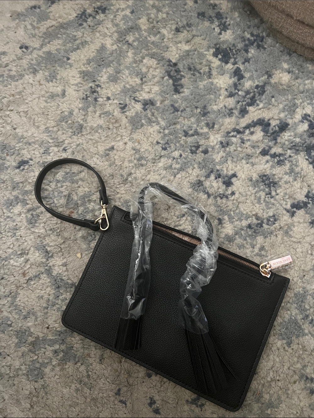 Brand new Anne Klein Black Pebbled Wristlet Clutch with Tassels
